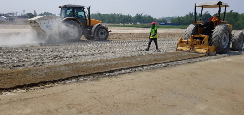 holcim binders to stabilize the soil being applied in the parking lot of the aquatic center